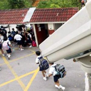 CCTV camera installed at school entrance for student safety and security.
