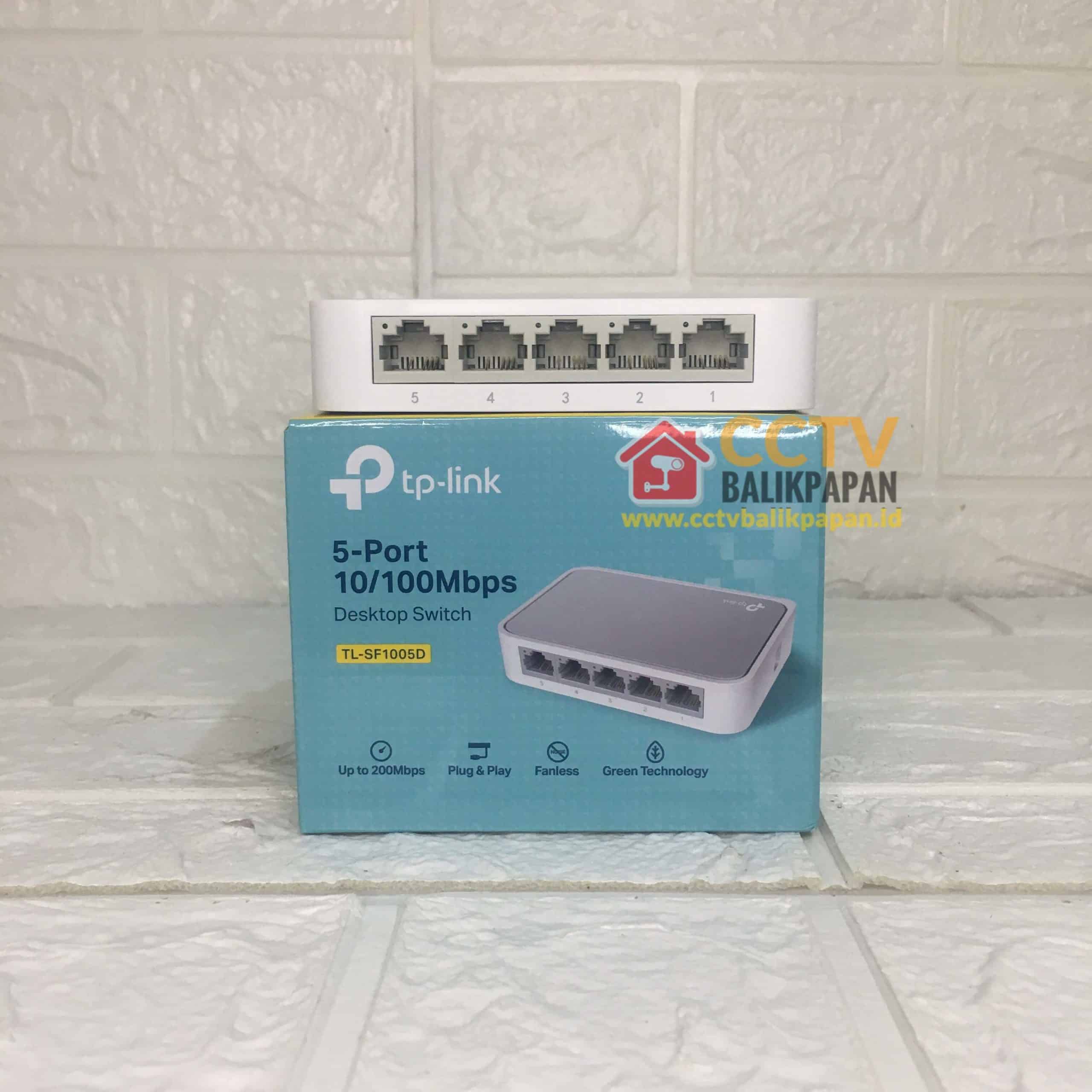 Compact TP-LINK 5-port 10/100Mbps network switch for reliable LAN connections.