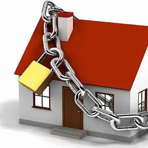 House secured with CCTV camera and chain lock for mudik safety.
