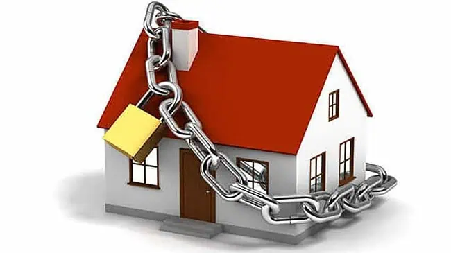 Home Security with CCTV During Mudik House secured with CCTV camera and chain lock for mudik safety.