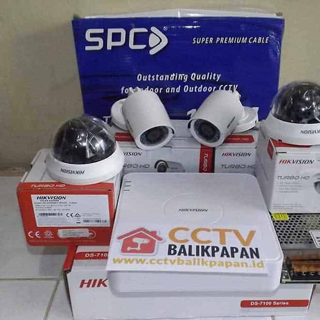 CCTV camera components including dome cameras, cables, and power supplies for security setups.