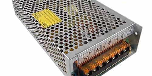 Power Supply Unit for CCTV Cameras in Balikpapan Metal power supply unit for CCTV cameras with terminal connections, used in security systems.